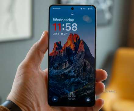 Here's When Your OnePlus Will Get Android 16 (OxygenOS 16) 4 A person holding the OnePlus 13R on the lock screen.