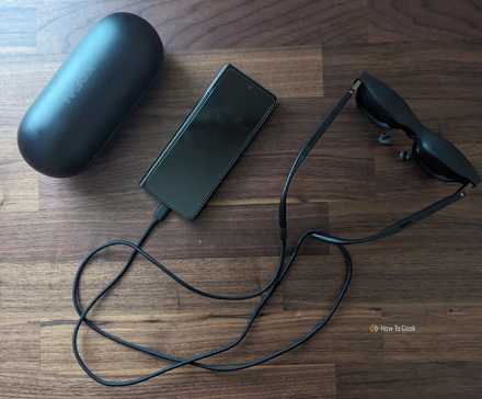 A Samsung Galaxy Z Fold 5, XREAL Air 2 Pro AR Glasses, and glasses case.