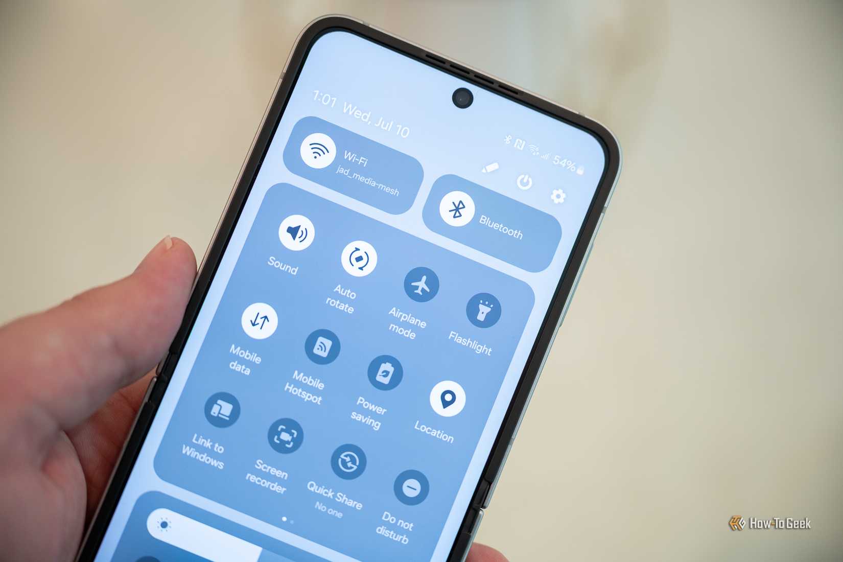 Galaxy Z Flip 6 fully open showing the notification bar. 