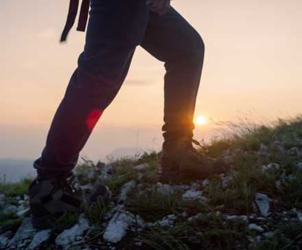 Someone hiking on a mountain.