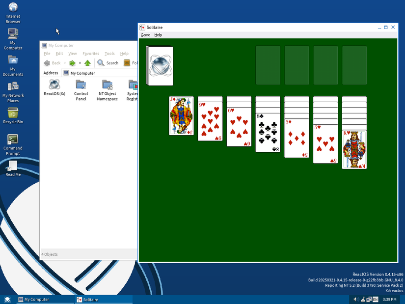 ReactOS desktop with File Explorer and Solitaire game.